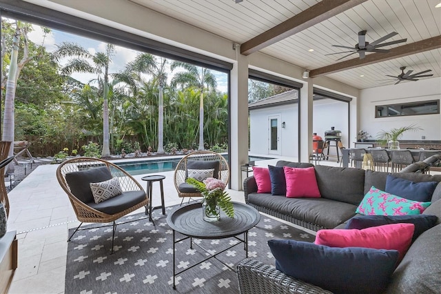 sunroom featuring beamed ceiling, ceiling fan, a pool, and wooden ceiling