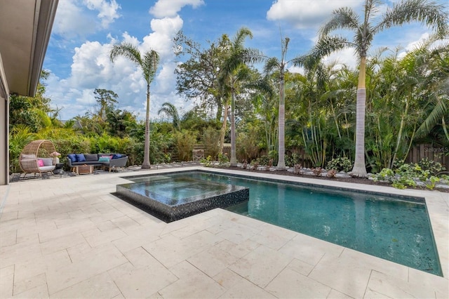 view of pool featuring a patio area, an outdoor hangout area, and an in ground hot tub