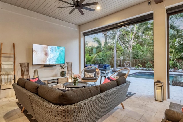 interior space featuring a pool, ceiling fan, and wooden ceiling