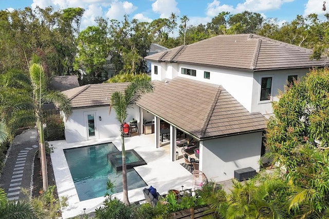 rear view of property with an outdoor hangout area, a patio area, and central air condition unit