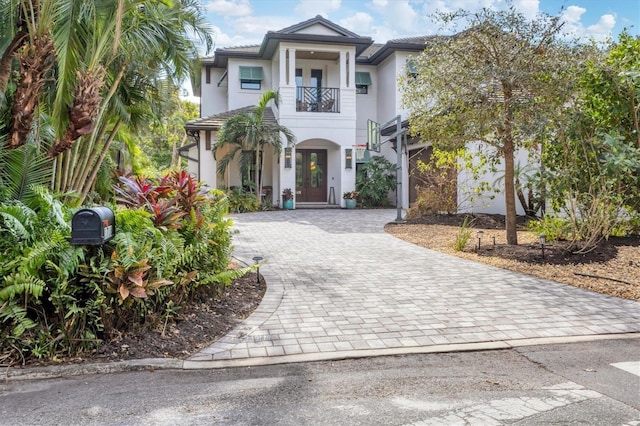 view of front of property with a balcony