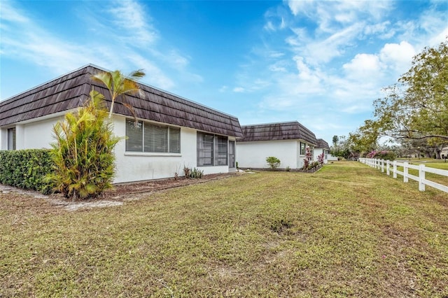 view of property exterior featuring a yard