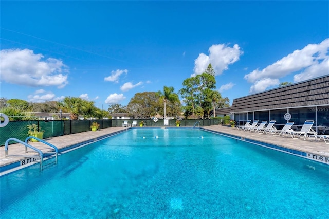 view of swimming pool featuring a patio area