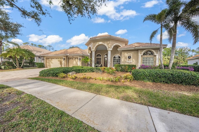 mediterranean / spanish-style house featuring a garage