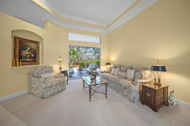 tiled living room with a tray ceiling, crown molding, and a high ceiling