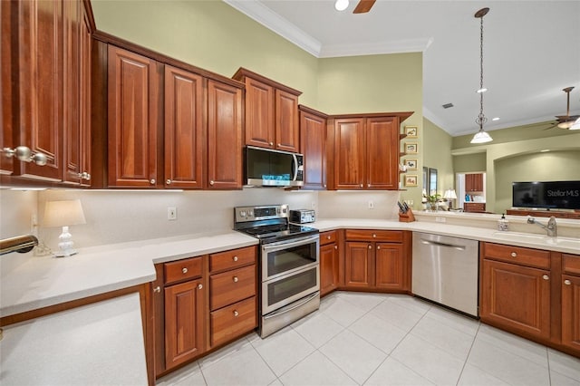 kitchen featuring crown molding, sink, hanging light fixtures, light tile patterned flooring, and stainless steel appliances