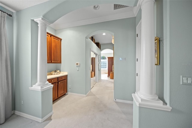 corridor with light carpet and crown molding