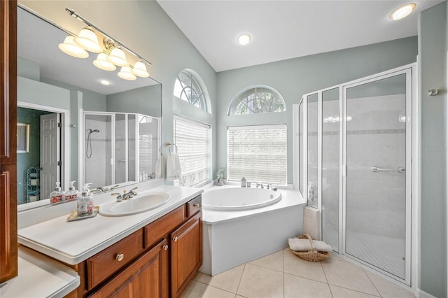 bathroom with tile patterned floors, vanity, and plus walk in shower