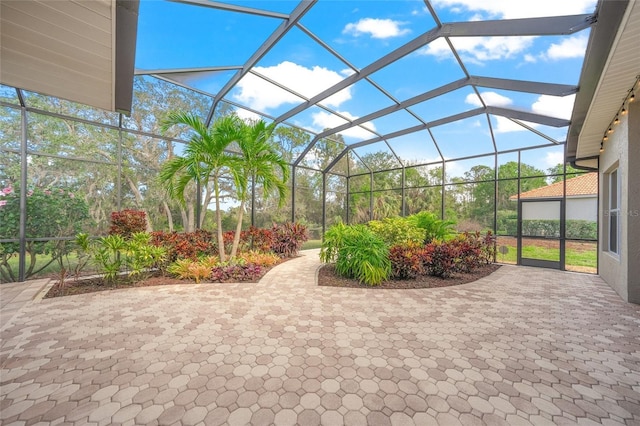 view of patio / terrace featuring a lanai