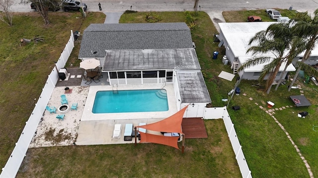 view of pool featuring a sunroom and a patio area