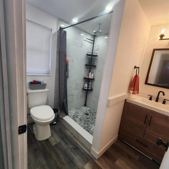 bathroom with vanity, hardwood / wood-style flooring, toilet, and a shower with shower curtain