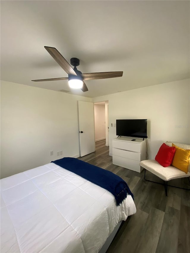 bedroom featuring hardwood / wood-style floors and ceiling fan