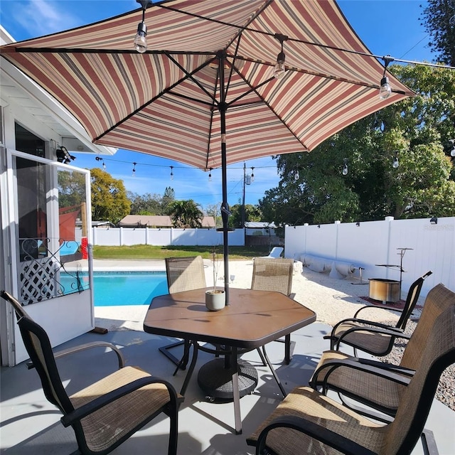 view of patio / terrace featuring a fenced in pool