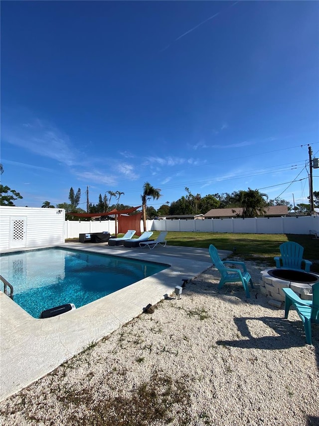 view of pool featuring a patio and an outdoor fire pit