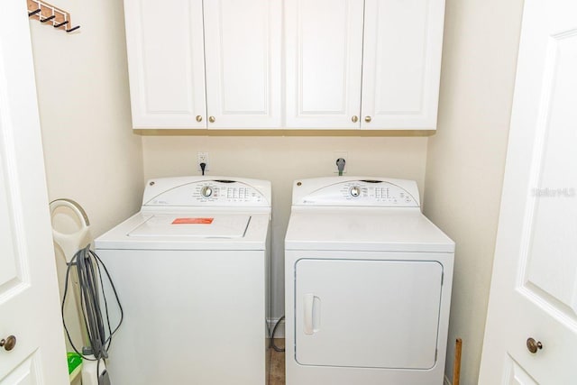 laundry room with cabinet space and independent washer and dryer