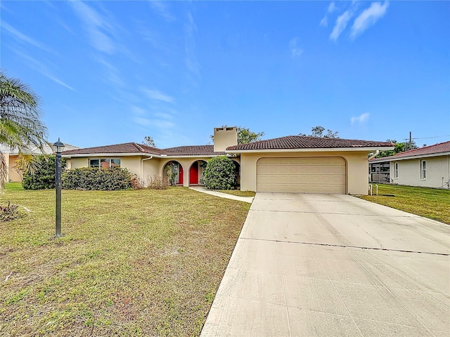 view of front facade with a front yard and a garage