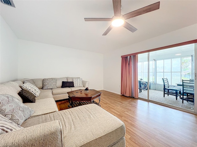 living room with hardwood / wood-style floors and ceiling fan