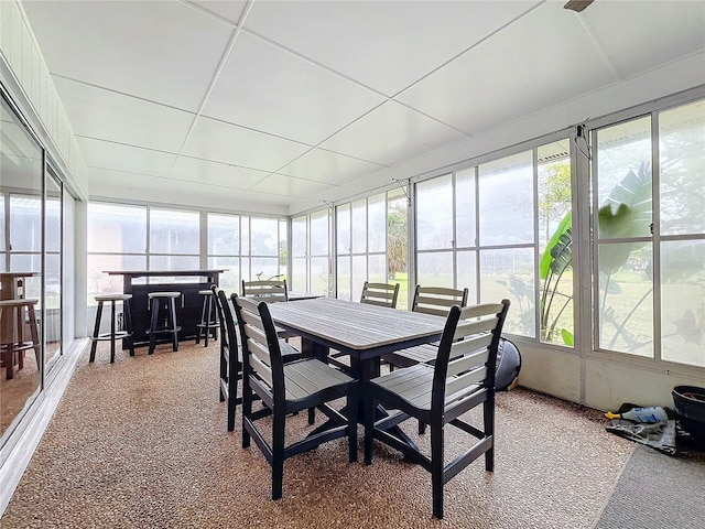 sunroom featuring a paneled ceiling