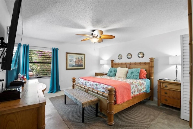 bedroom featuring a textured ceiling and ceiling fan