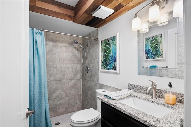 bathroom featuring a shower with curtain, vanity, and toilet