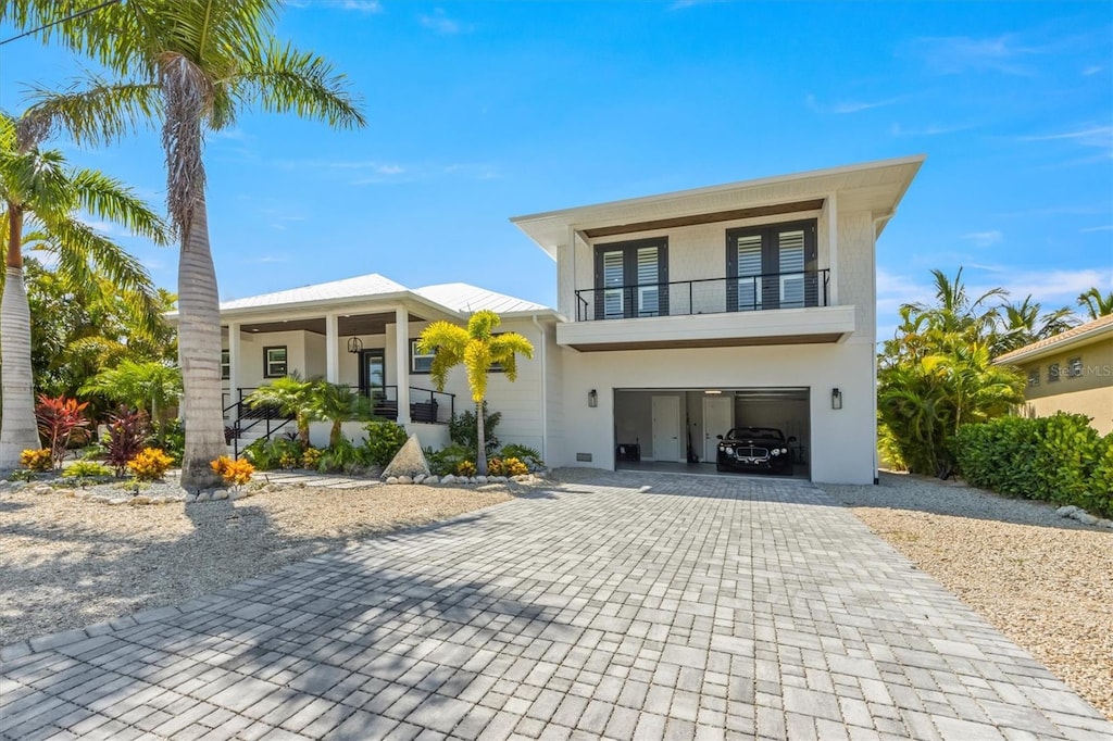 505 69th St, Holmes Beach, FL 34217 - contemporary home featuring a balcony