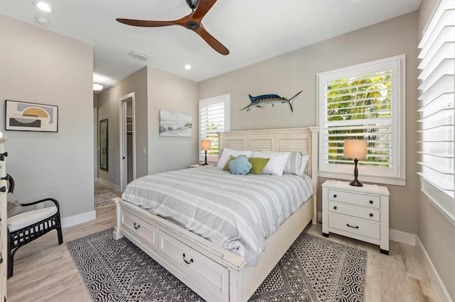 bedroom featuring light hardwood / wood-style floors and ceiling fan