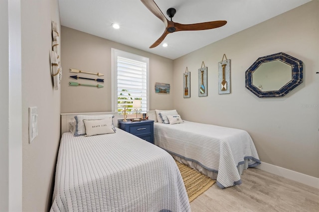 bedroom featuring ceiling fan and light hardwood / wood-style floors