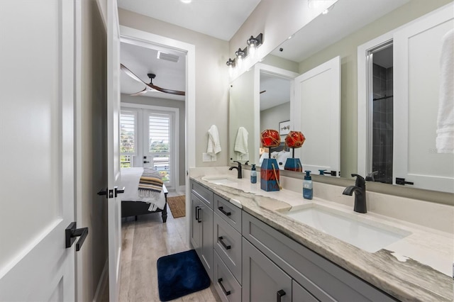 bathroom with vanity and hardwood / wood-style flooring