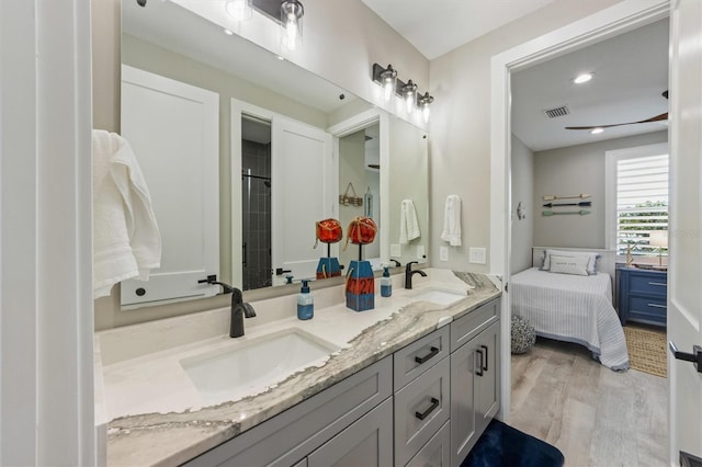 bathroom with vanity and wood-type flooring