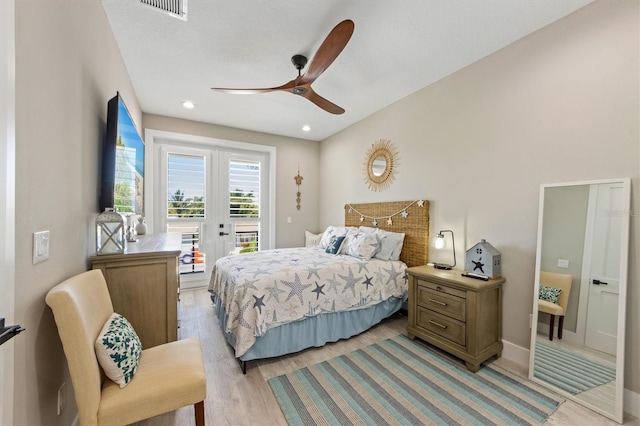 bedroom with ceiling fan, light hardwood / wood-style floors, and access to exterior