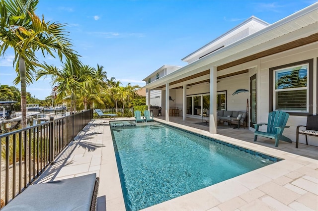 view of swimming pool with outdoor lounge area and a patio area