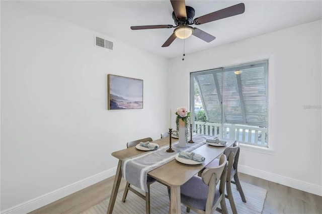 dining area featuring ceiling fan and light hardwood / wood-style flooring