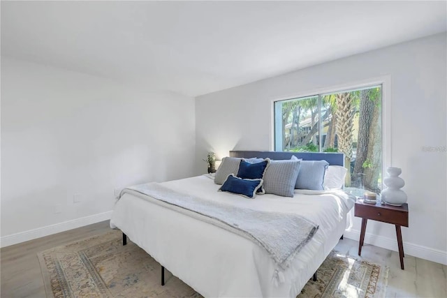 bedroom featuring wood-type flooring