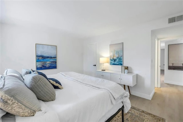 bedroom with light hardwood / wood-style flooring