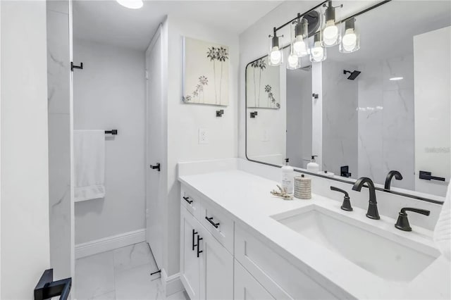 bathroom featuring a shower and vanity