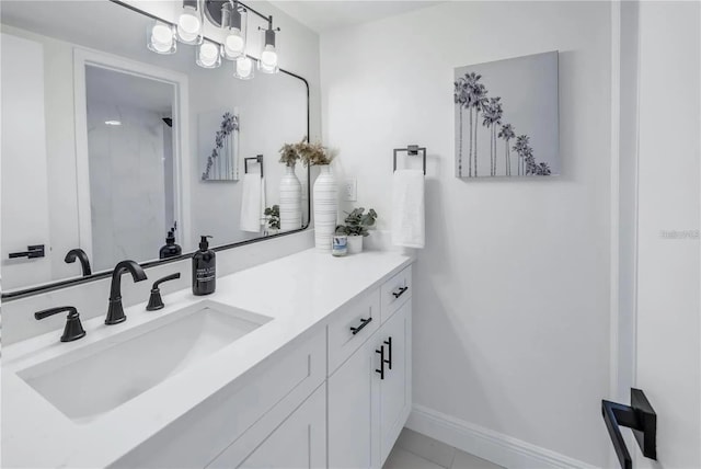 bathroom featuring tile patterned flooring and vanity