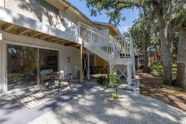 back of property featuring a patio