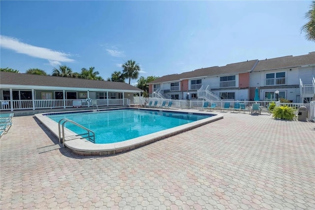 view of swimming pool with a patio area