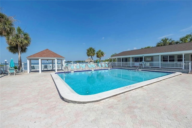 view of swimming pool featuring a patio area