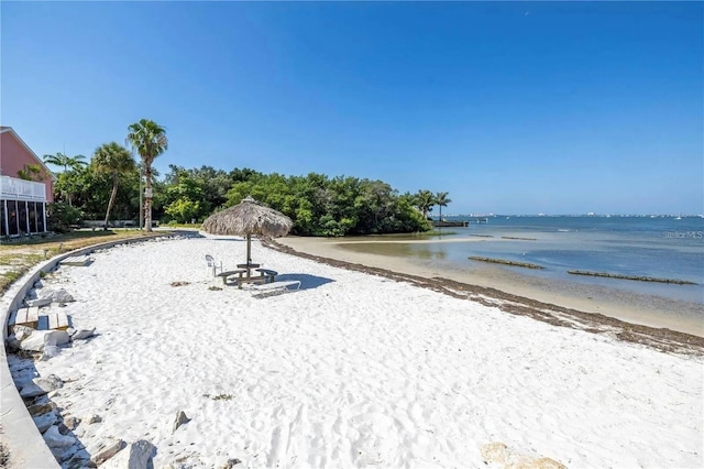 property view of water featuring a beach view