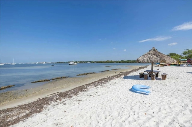 property view of water featuring a beach view