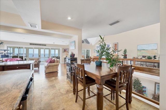 dining space featuring a water view