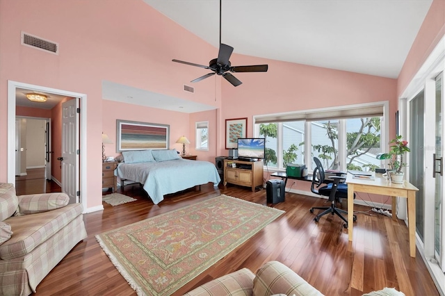 bedroom featuring ceiling fan, hardwood / wood-style floors, and high vaulted ceiling