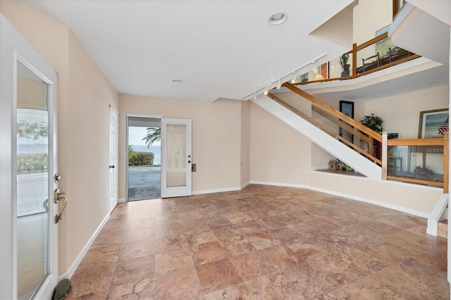 16 Tidy Island Blvd Unit 16, Bradenton, FL 34210 - entrance foyer featuring stone finish flooring, stairs, baseboards, and recessed lighting