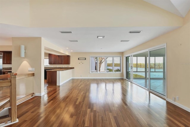 16 Tidy Island Blvd Unit 16, Bradenton, FL 34210 - unfurnished living room with dark wood finished floors and baseboards