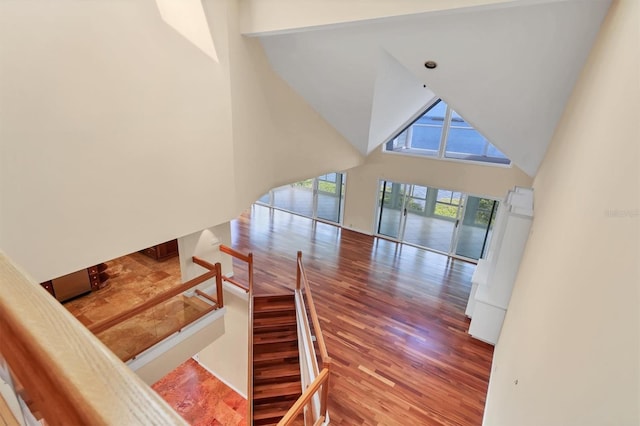 16 Tidy Island Blvd Unit 16, Bradenton, FL 34210 - stairs with high vaulted ceiling, wood finished floors, and a water view