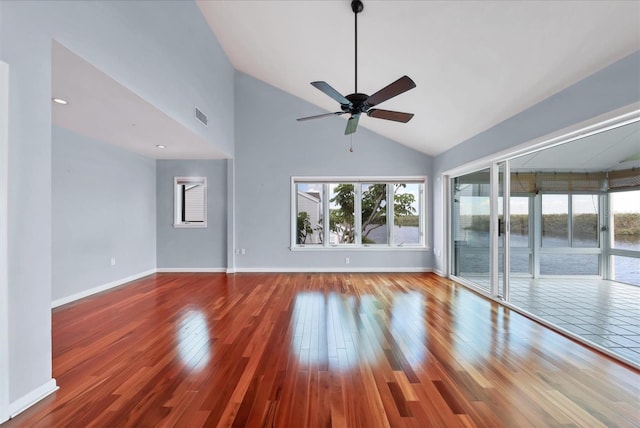 16 Tidy Island Blvd Unit 16, Bradenton, FL 34210 - unfurnished room featuring plenty of natural light, wood finished floors, ceiling fan, and high vaulted ceiling