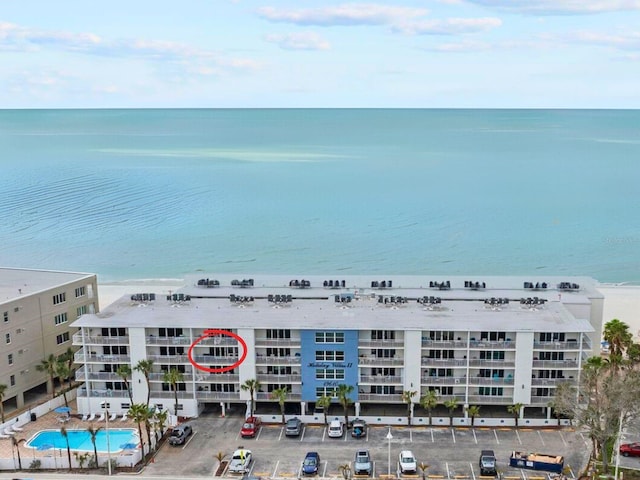 aerial view with a water view and a view of the beach