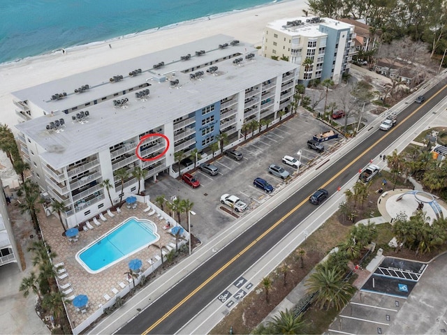 aerial view featuring a water view and a beach view