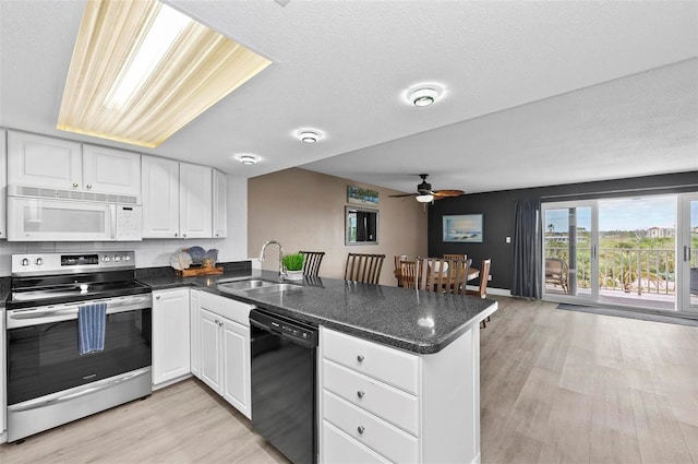 kitchen with white cabinets, dishwasher, stainless steel electric range oven, and kitchen peninsula